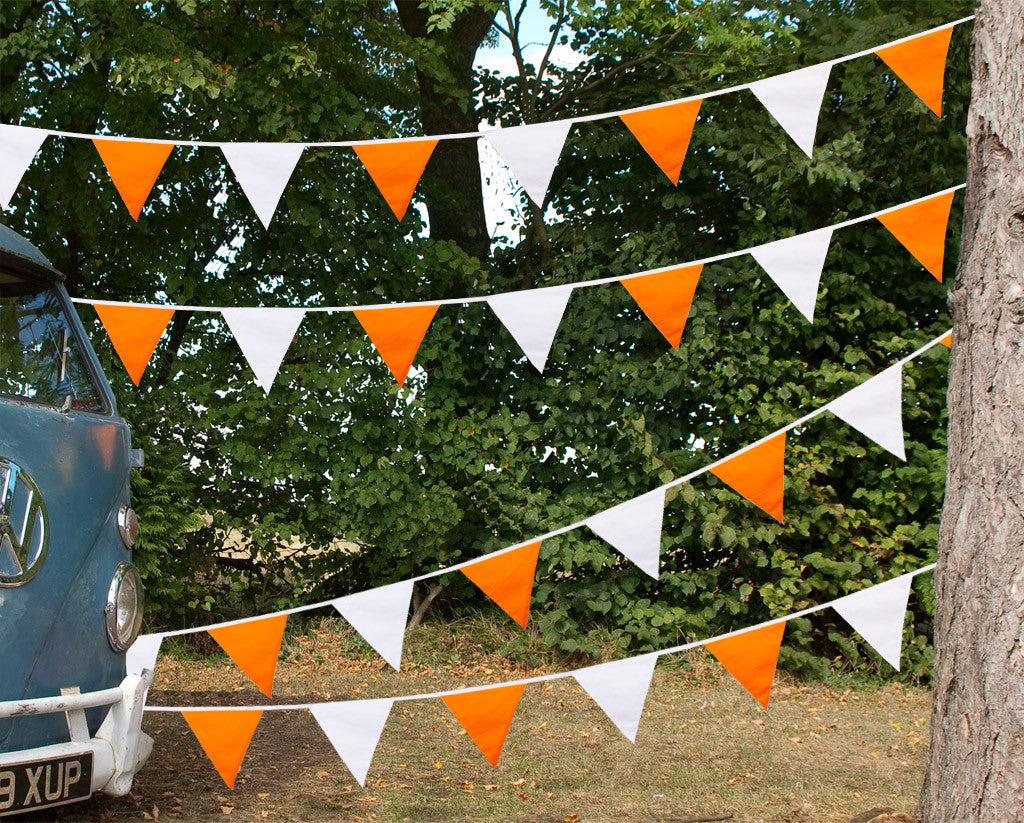Orange and White Bunting Camper Van