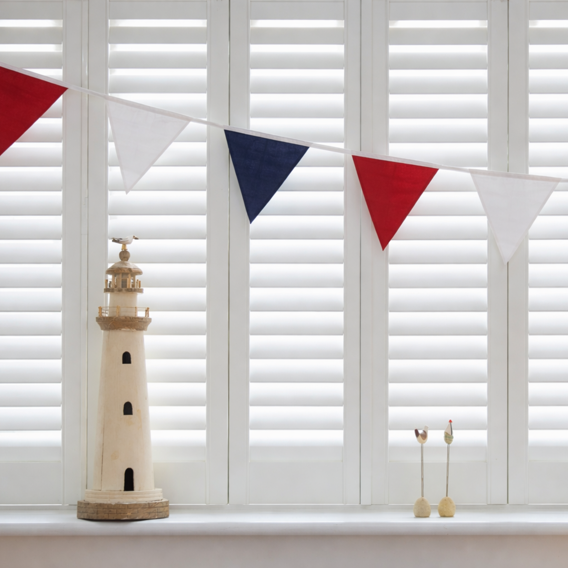 Red White and Blue Bunting Cotton on a window with shutters