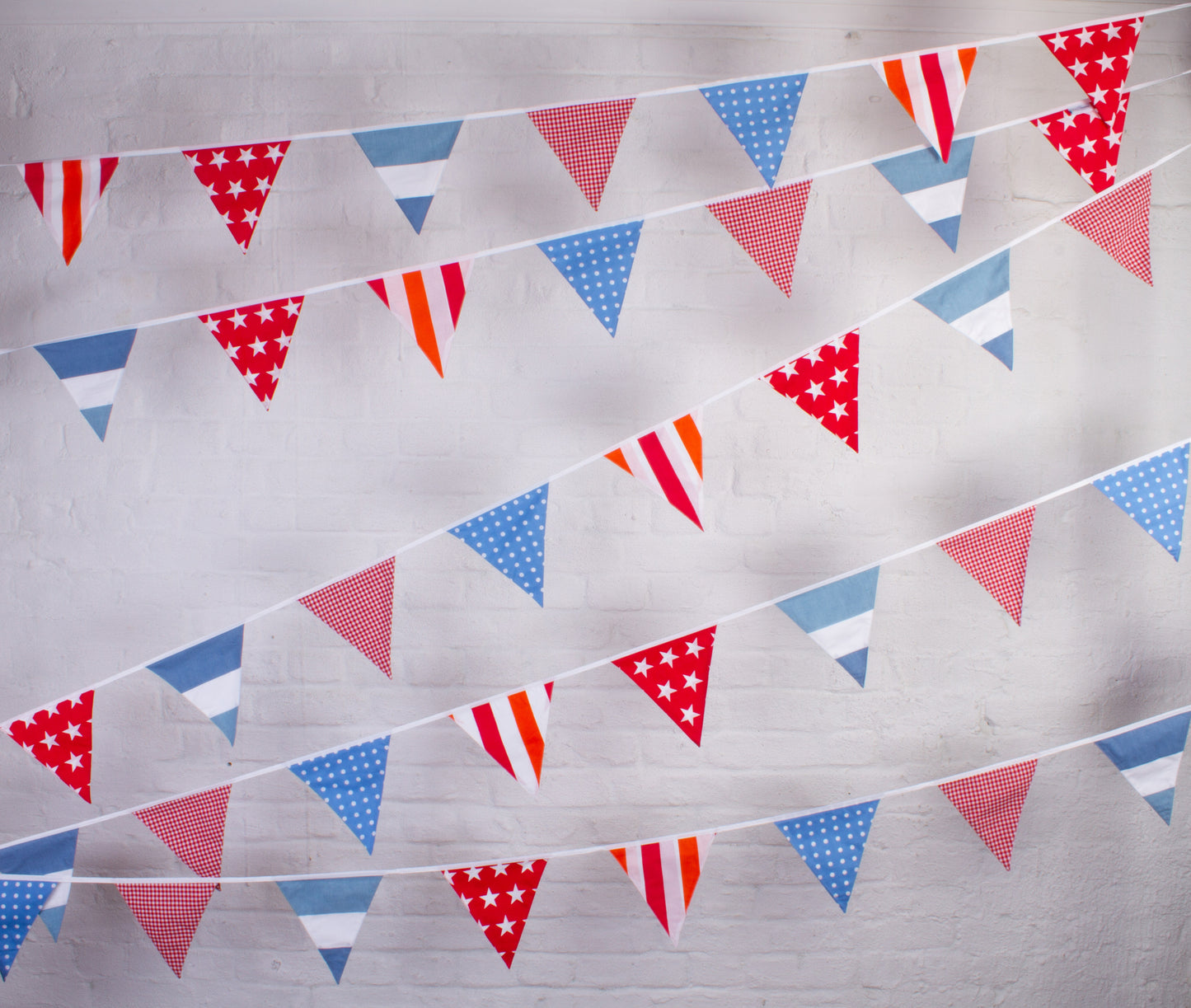 String of red, white, and blue triangular flags on a bunting