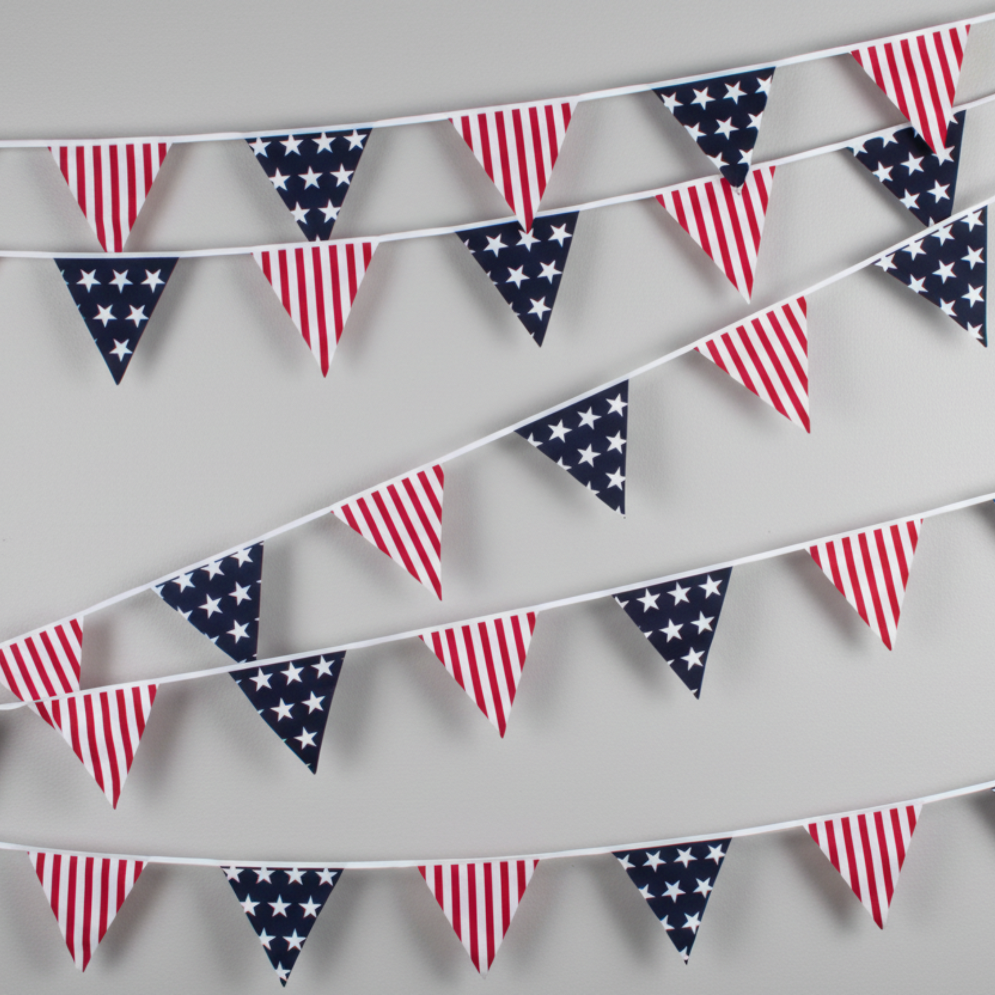 American flag bunting on a gray background